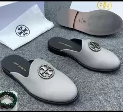 Tory Burch Logo Mules or Tory Burch Flat Slippers.